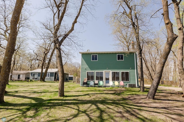 20841AND20850 Leona Beach Rd, Erie Twp, MN 56578 - back of property with a yard and central AC unit