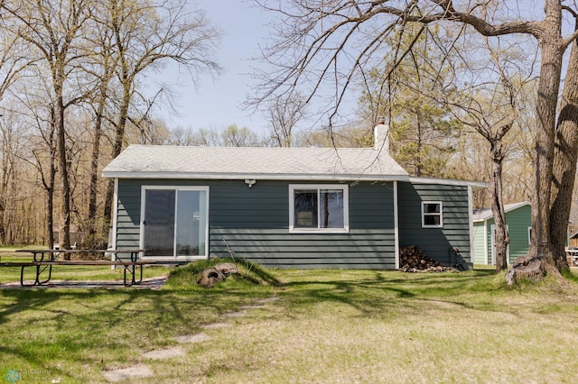 20841AND20850 Leona Beach Rd, Erie Twp, MN 56578 - view of front of property with a chimney and a front lawn