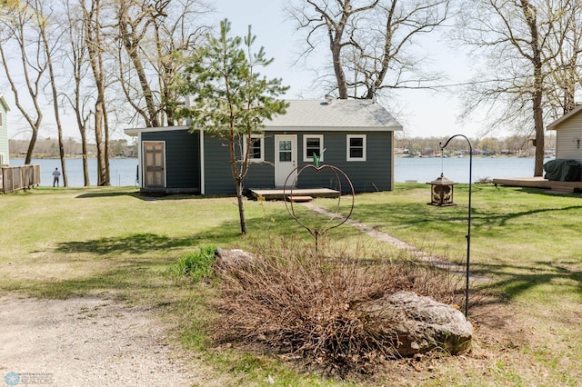 20841AND20850 Leona Beach Rd, Erie Twp, MN 56578 - view of front of house with a front yard, roof with shingles, and a water view