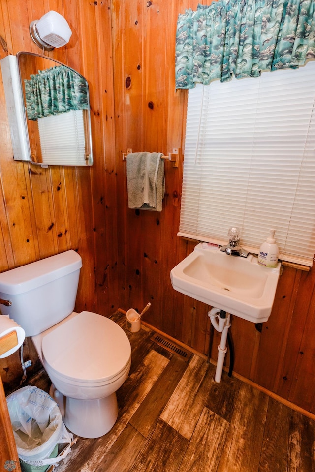 20841AND20850 Leona Beach Rd, Erie Twp, MN 56578 - bathroom with wood finished floors, toilet, and wooden walls