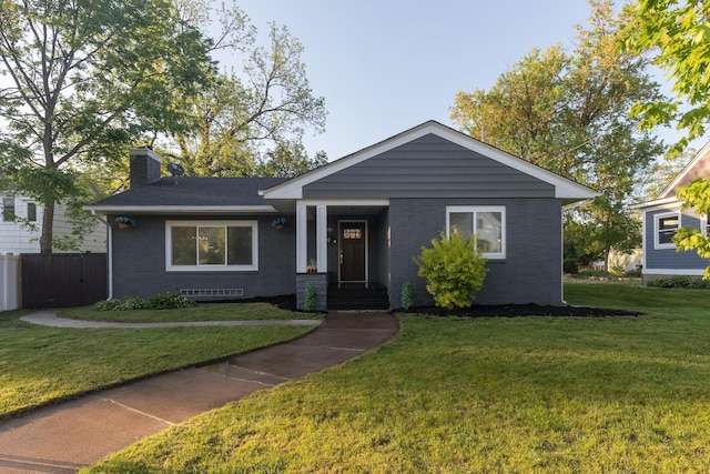 615 Vine St, Hudson, WI 54016 - view of front facade featuring brick siding and a chimney
