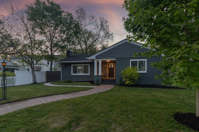 615 Vine St, Hudson, WI 54016 - view of front of property with brick siding and a chimney