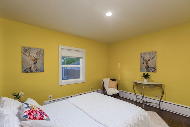 615 Vine St, Hudson, WI 54016 - bedroom featuring baseboard heating, wood finished floors, baseboards, and recessed lighting