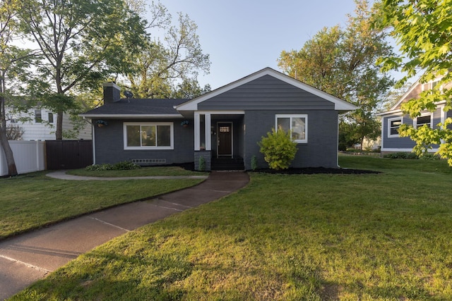 615 Vine St, Hudson, WI 54016 - view of front of house with a chimney and brick siding