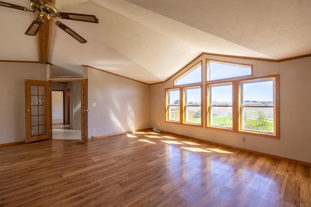 36308 Edgewood Rd, Harmony, MN 55939 - spare room featuring vaulted ceiling, baseboards, wood finished floors, and ceiling fan