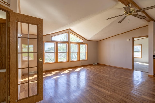 36308 Edgewood Rd, Harmony, MN 55939 - unfurnished living room with lofted ceiling, wood finished floors, a ceiling fan, and baseboards