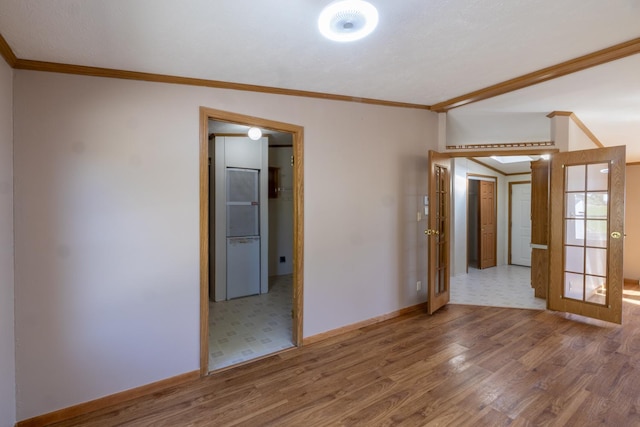 36308 Edgewood Rd, Harmony, MN 55939 - empty room with wood finished floors, crown molding, and baseboards