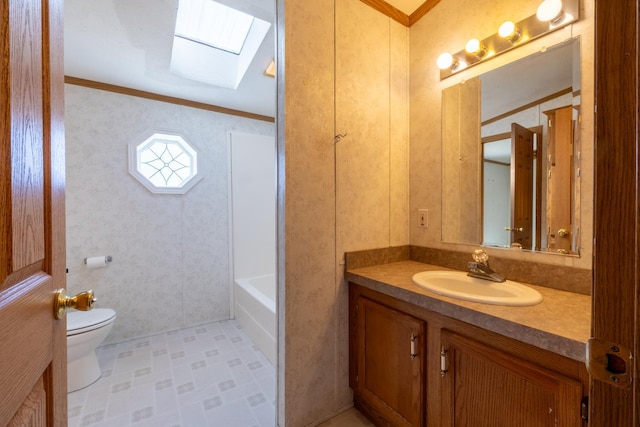 36308 Edgewood Rd, Harmony, MN 55939 - full bathroom featuring a skylight, vanity, toilet, crown molding, and tile patterned floors