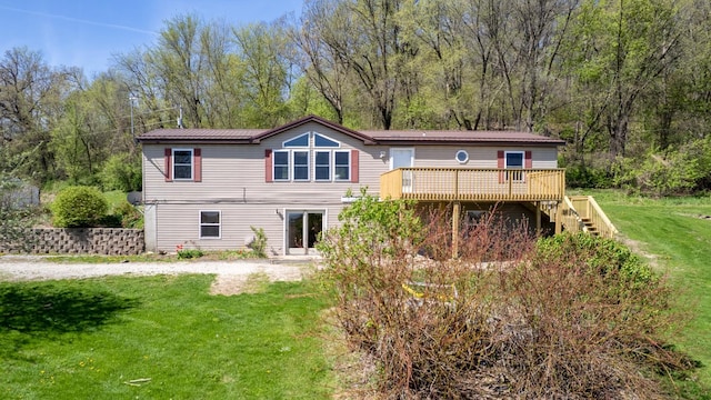 36308 Edgewood Rd, Harmony, MN 55939 - view of front of home featuring a deck, a front lawn, and stairway