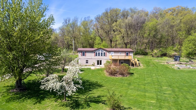 36308 Edgewood Rd, Harmony, MN 55939 - back of property with a wooden deck, stairway, a yard, and a view of trees