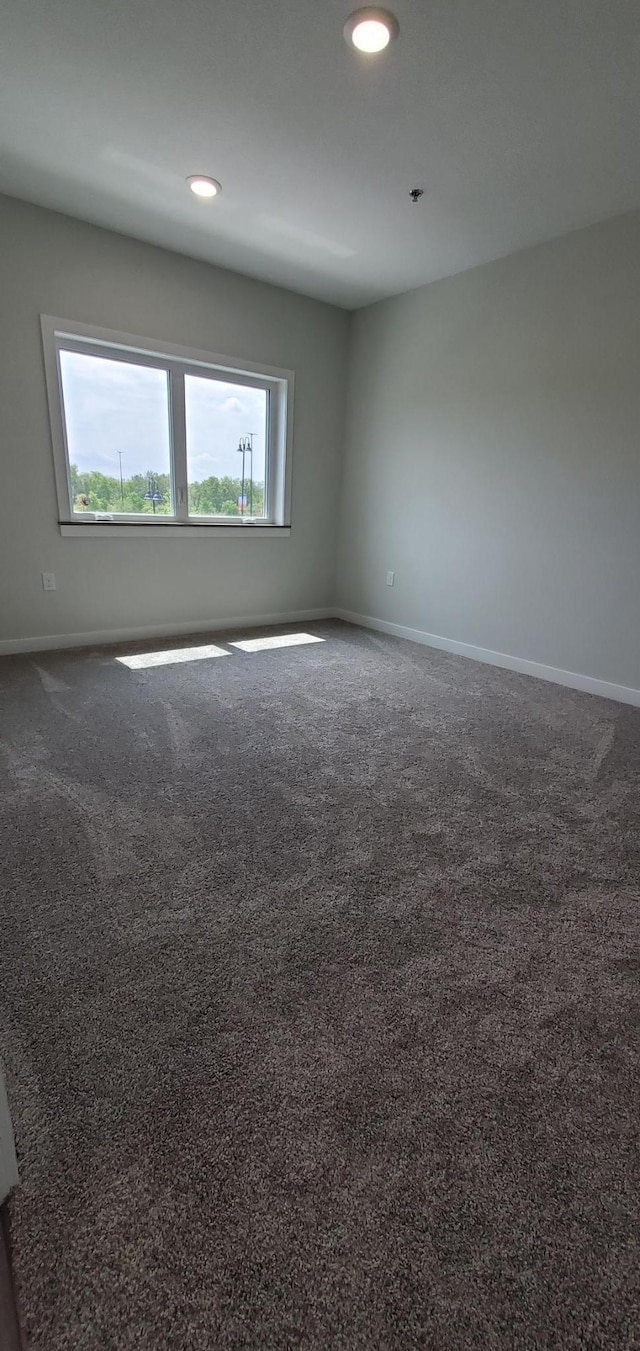 715 Lake Shore Dr NE Unit 207, Bemidji, MN 56601 - carpeted empty room with baseboards and recessed lighting