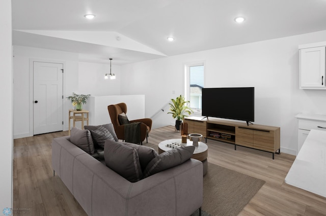 7279 26th St S, Fargo, ND 58104 - living room featuring vaulted ceiling, light wood-style flooring, baseboards, and recessed lighting