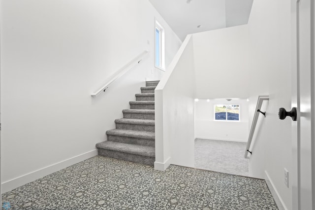 7279 26th St S, Fargo, ND 58104 - stairway with baseboards and tile patterned floors