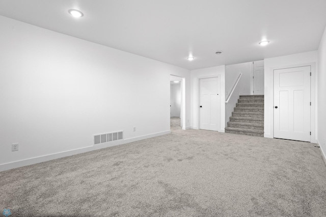 7279 26th St S, Fargo, ND 58104 - spare room featuring carpet floors, stairway, and baseboards