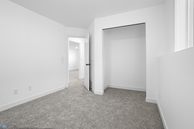 7279 26th St S, Fargo, ND 58104 - unfurnished bedroom with carpet flooring, baseboards, and a closet