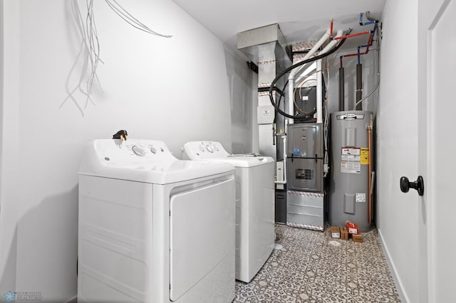 7279 26th St S, Fargo, ND 58104 - laundry area featuring electric water heater, washing machine and clothes dryer, baseboards, and heating unit
