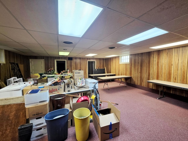 642 6th Ave, Calumet, MN 55716 - playroom featuring a drop ceiling, wooden walls, and carpet