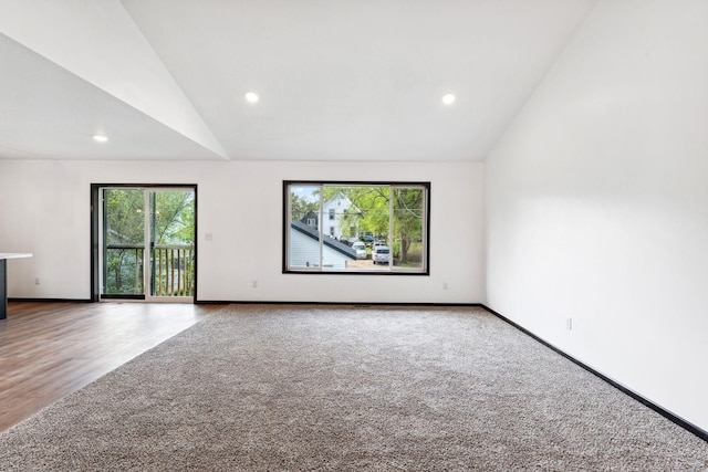 1094 7th St E, Saint Paul, MN 55106 - carpeted spare room featuring vaulted ceiling, recessed lighting, and baseboards