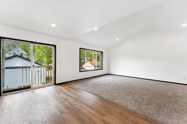 1094 7th St E, Saint Paul, MN 55106 - empty room with lofted ceiling, recessed lighting, baseboards, and wood finished floors