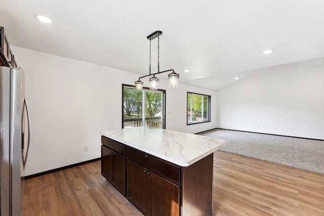 1094 7th St E, Saint Paul, MN 55106 - kitchen featuring freestanding refrigerator, dark brown cabinetry, light wood finished floors, a center island, and recessed lighting