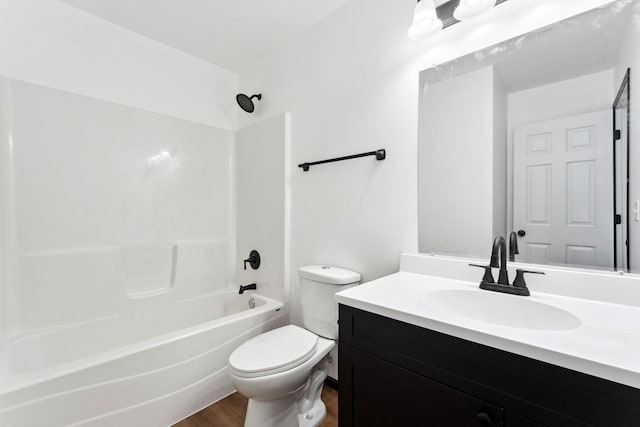 1094 7th St E, Saint Paul, MN 55106 - full bathroom with wood finished floors, toilet, washtub / shower combination, and vanity