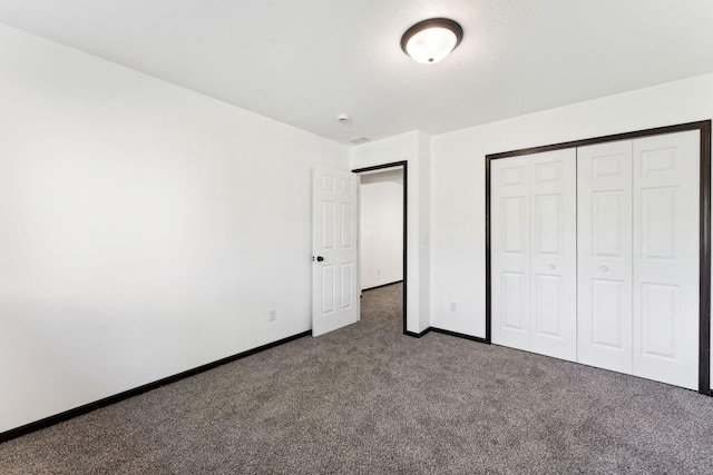 1094 7th St E, Saint Paul, MN 55106 - unfurnished bedroom with carpet flooring, baseboards, and a closet