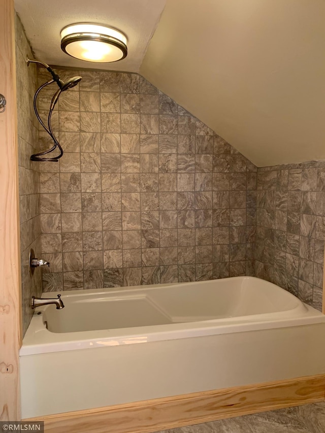 bathroom with lofted ceiling