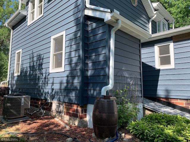view of home's exterior with central air condition unit