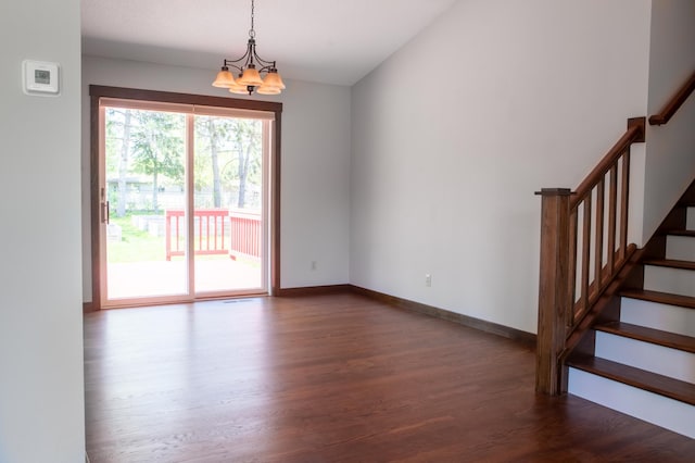 1377 Parkview Dr, New Richmond, WI 54017 - empty room with dark wood-type flooring, a chandelier, stairs, and baseboards