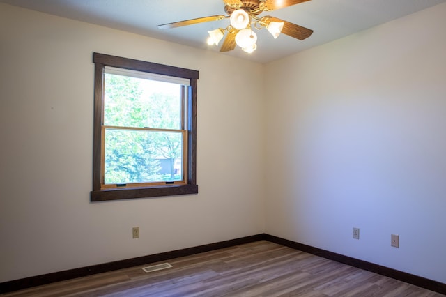 1377 Parkview Dr, New Richmond, WI 54017 - spare room featuring wood finished floors, baseboards, and ceiling fan