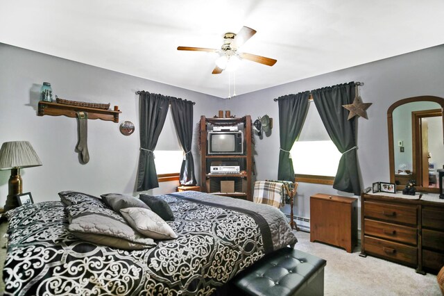 26163 170th St, New Richland, MN 56072 - carpeted bedroom with a baseboard radiator and a ceiling fan