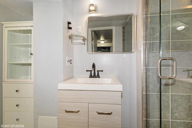 full bathroom with vanity and a shower stall