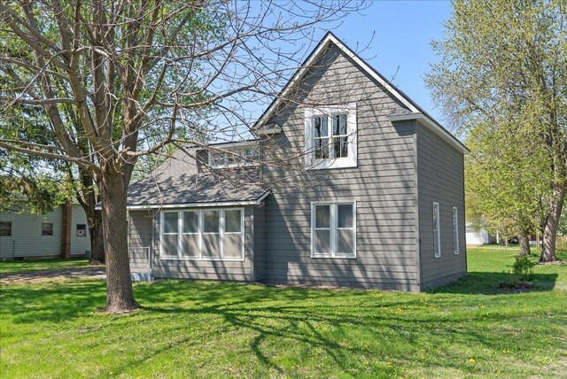 231 High St, New Richmond, WI 54017 - rear view of house with a yard