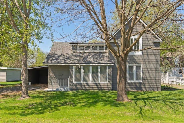231 High St, New Richmond, WI 54017 - back of house with a lawn and driveway