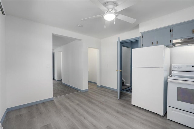 231 High St, New Richmond, WI 54017 - kitchen with white appliances, under cabinet range hood, light wood-style floors, a ceiling fan, and blue cabinetry