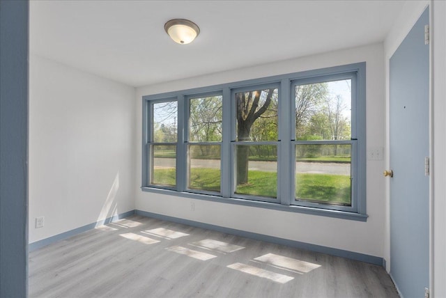 231 High St, New Richmond, WI 54017 - unfurnished room featuring wood finished floors and baseboards