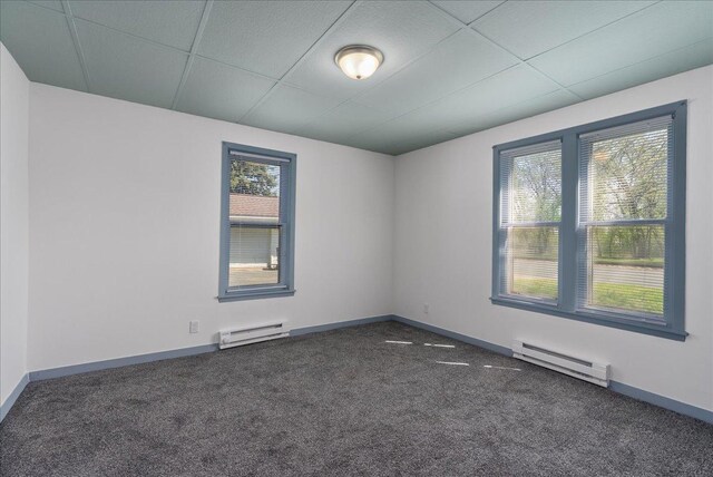 231 High St, New Richmond, WI 54017 - carpeted empty room featuring baseboard heating and baseboards