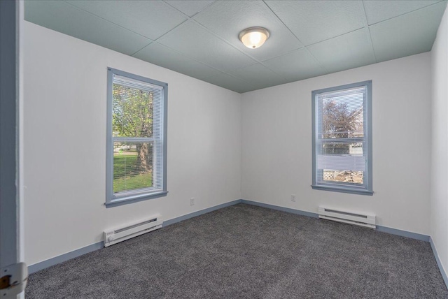 231 High St, New Richmond, WI 54017 - empty room featuring a baseboard radiator, carpet flooring, and baseboards