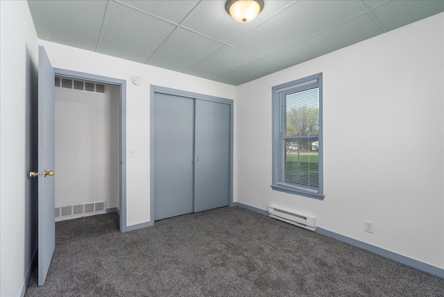 231 High St, New Richmond, WI 54017 - unfurnished bedroom with baseboard heating, carpet floors, a closet, and baseboards