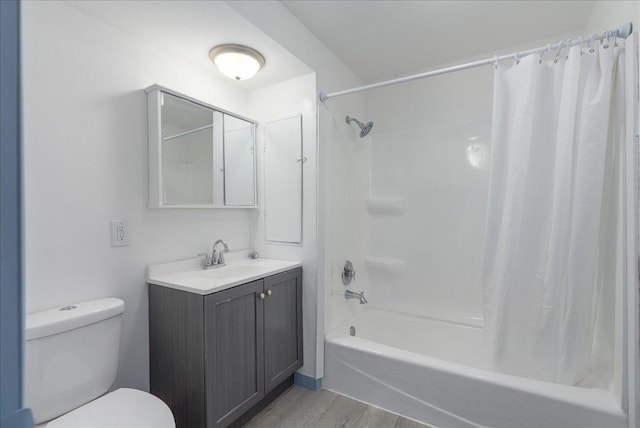 231 High St, New Richmond, WI 54017 - full bath with wood finished floors, toilet, shower / bath combo with shower curtain, and vanity