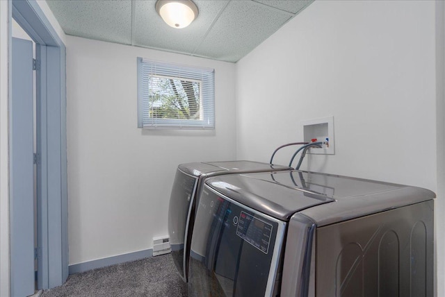 231 High St, New Richmond, WI 54017 - laundry room featuring washing machine and dryer, baseboards, dark carpet, and a baseboard radiator