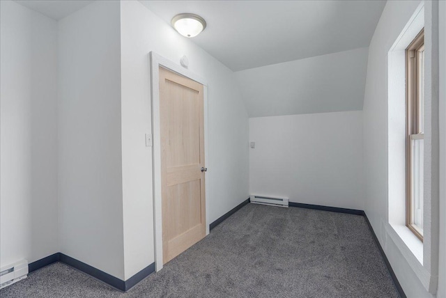 231 High St, New Richmond, WI 54017 - additional living space featuring baseboard heating, plenty of natural light, carpet flooring, and lofted ceiling