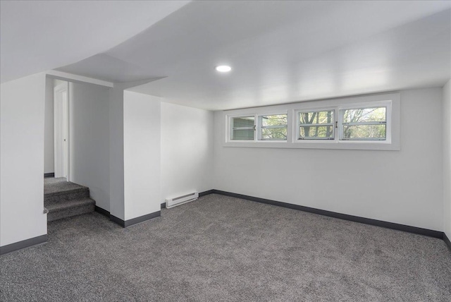 231 High St, New Richmond, WI 54017 - basement with dark carpet, baseboards, a baseboard heating unit, recessed lighting, and stairway