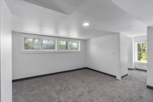 231 High St, New Richmond, WI 54017 - carpeted empty room with baseboards, healthy amount of natural light, and recessed lighting