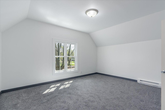 231 High St, New Richmond, WI 54017 - bonus room with baseboard heating, lofted ceiling, carpet, and baseboards
