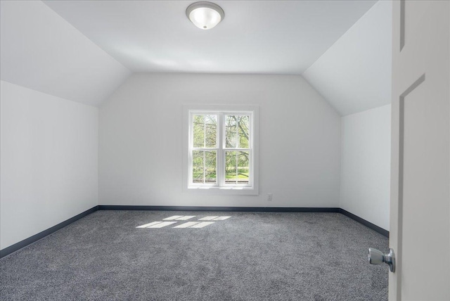 231 High St, New Richmond, WI 54017 - additional living space featuring carpet flooring, lofted ceiling, and baseboards