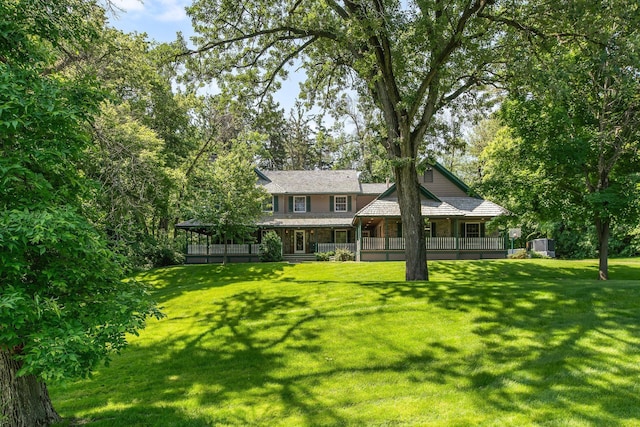 2 Pleasant Lake Rd, North Oaks, MN 55127 - view of front of home featuring a front yard and a porch