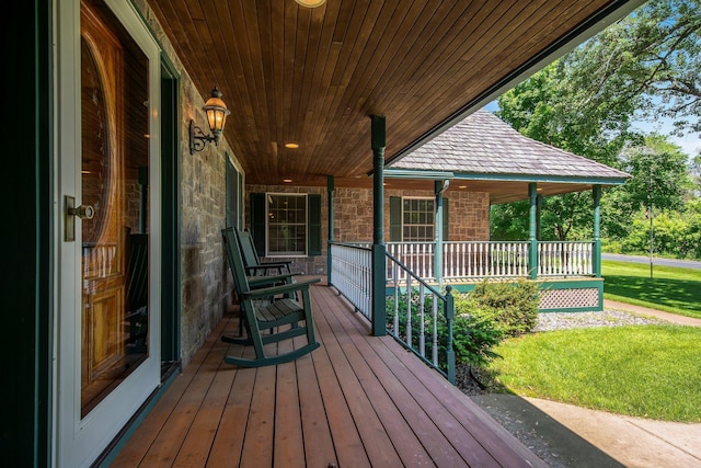 2 Pleasant Lake Rd, North Oaks, MN 55127 - wooden porch featuring a yard