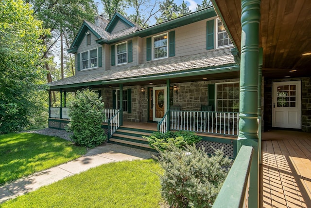 2 Pleasant Lake Rd, North Oaks, MN 55127 - view of front of property featuring covered porch, a chimney, a front yard, and stone siding