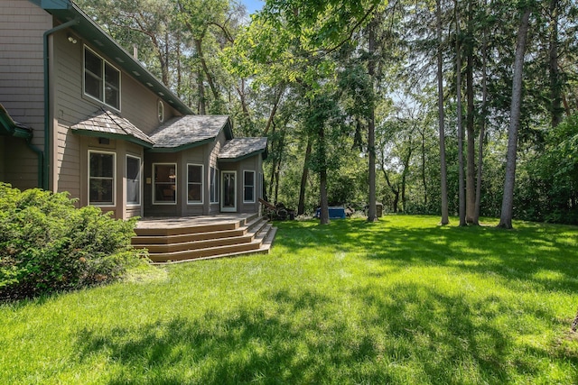 2 Pleasant Lake Rd, North Oaks, MN 55127 - view of grassy yard with a deck